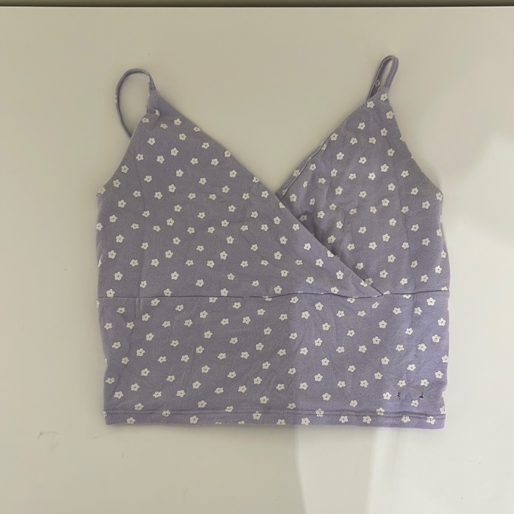 This cropped tank top is purple in size small and the brand is hollister.